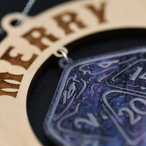 Decorative ornament with 'Merry Crit-mas' text and a purple and silver design.