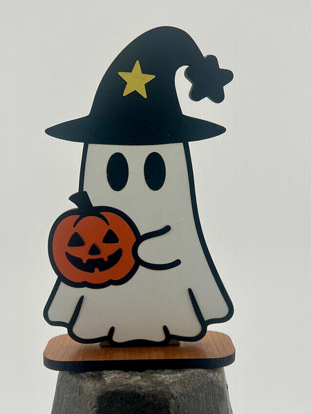 Halloween-themed ghost figurine with a witch hat and pumpkin on a white background